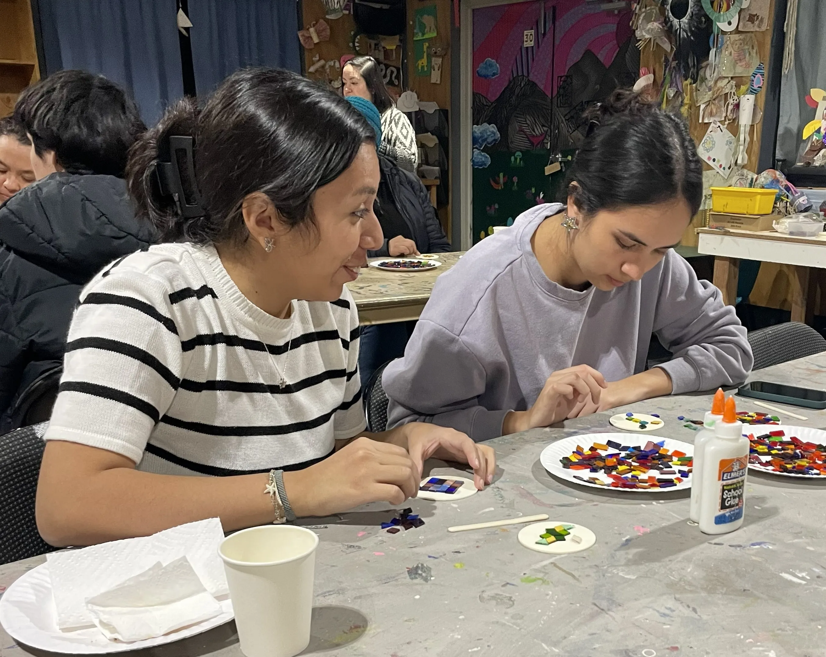 Community members creating mosaic art together at a Teton Valley workshop