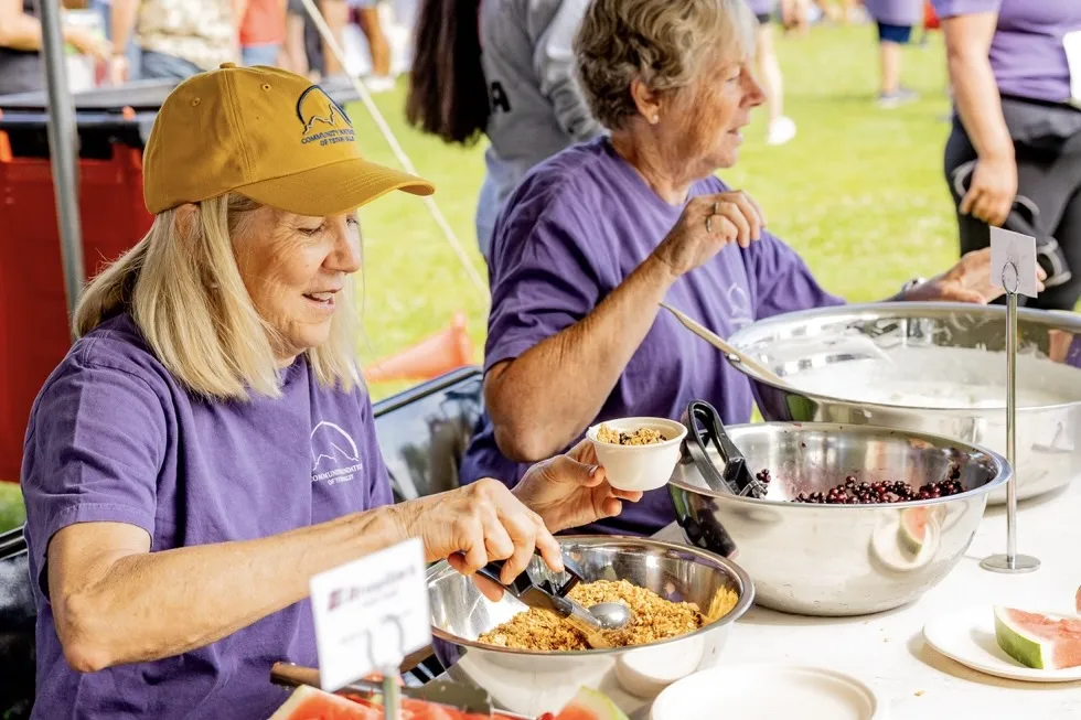 Community members celebrating at the Tin Cup Challenge event in Teton Valley