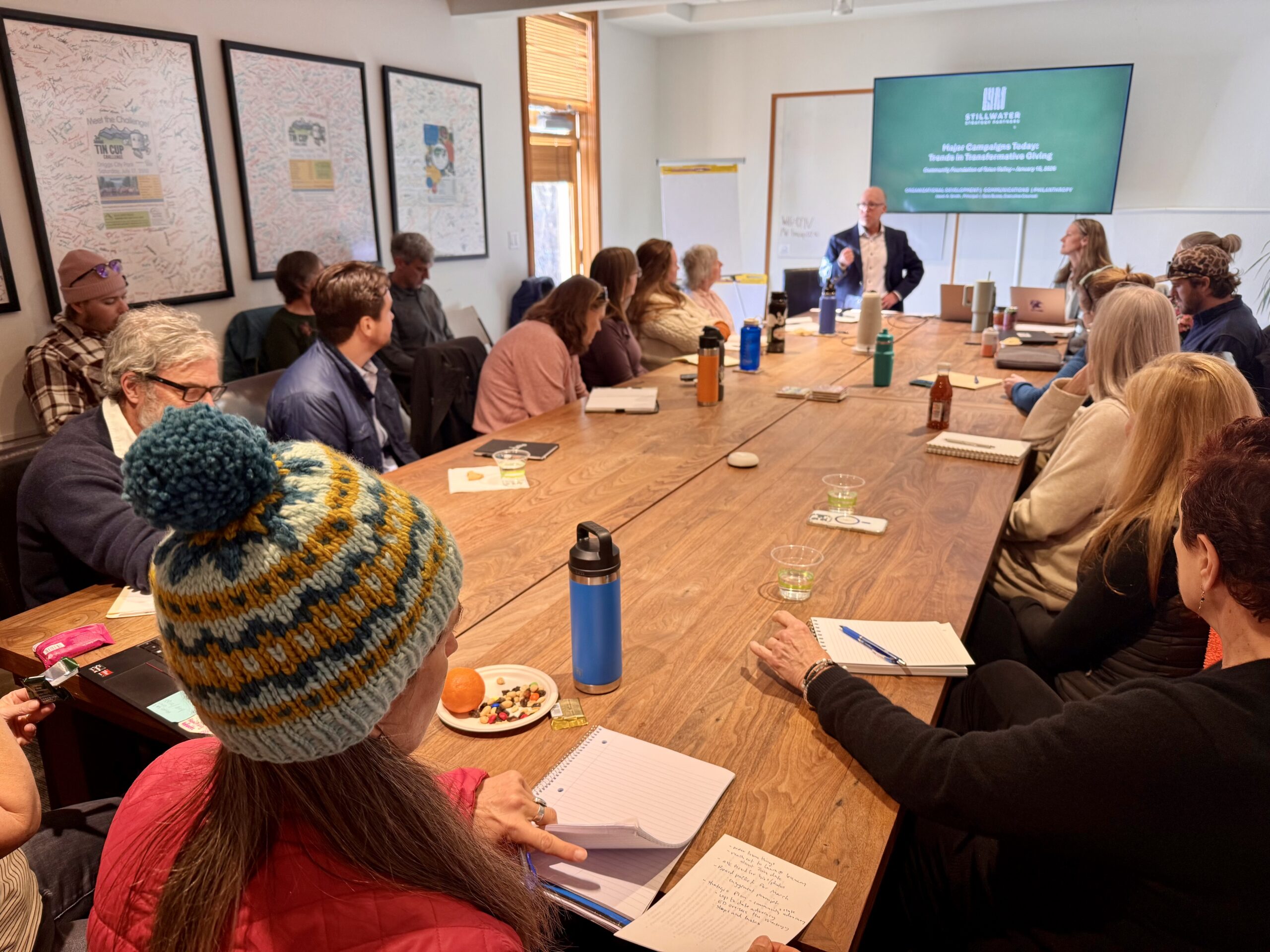 Nonprofit leaders gathered around the conference table for a workshop presentation